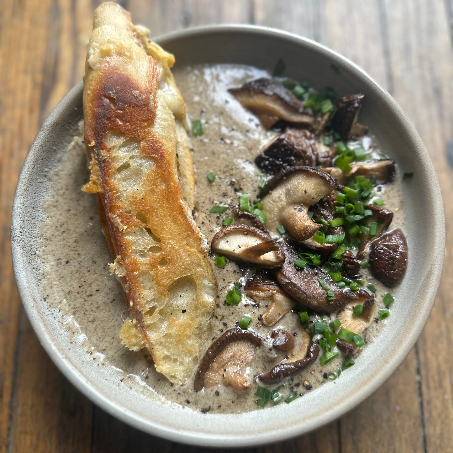 smoked mushroom soup topped with grilled shitake mushrooms and served with grueye grilled cheese