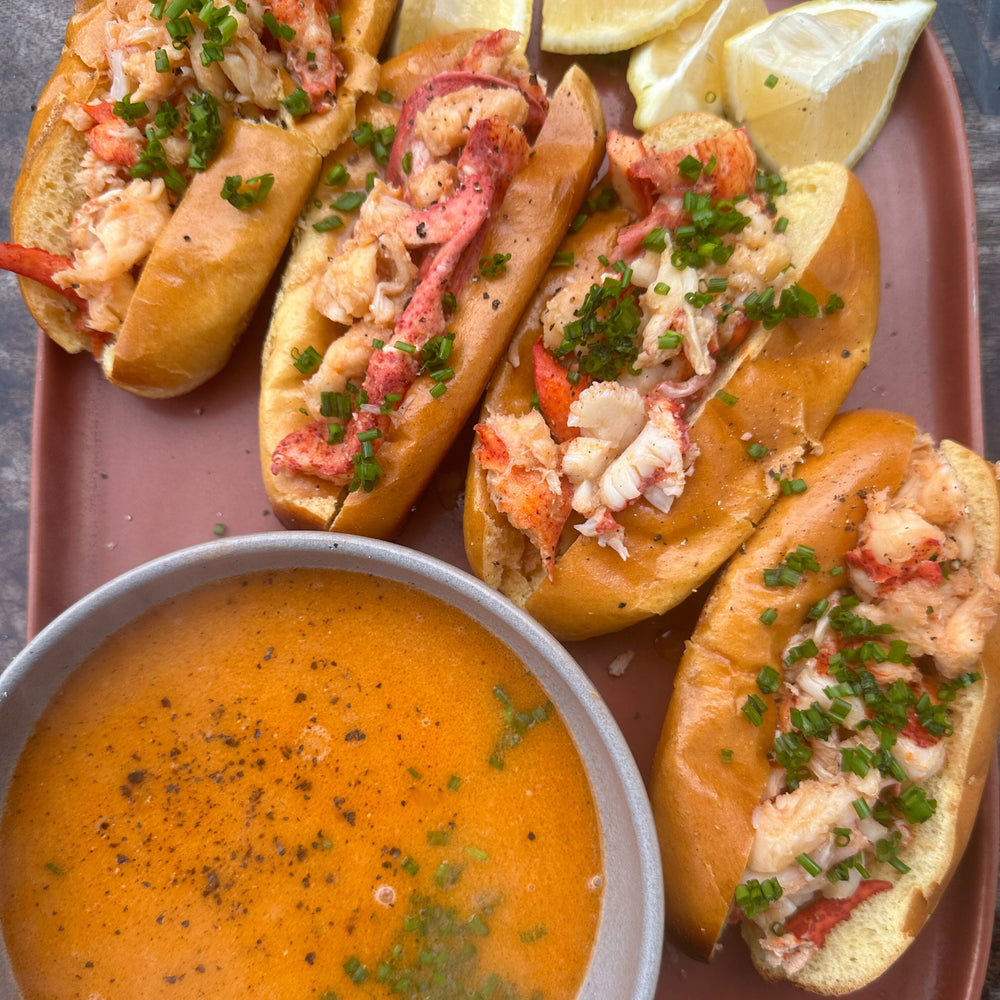 lobster rolls with a bowl of lobster bisque